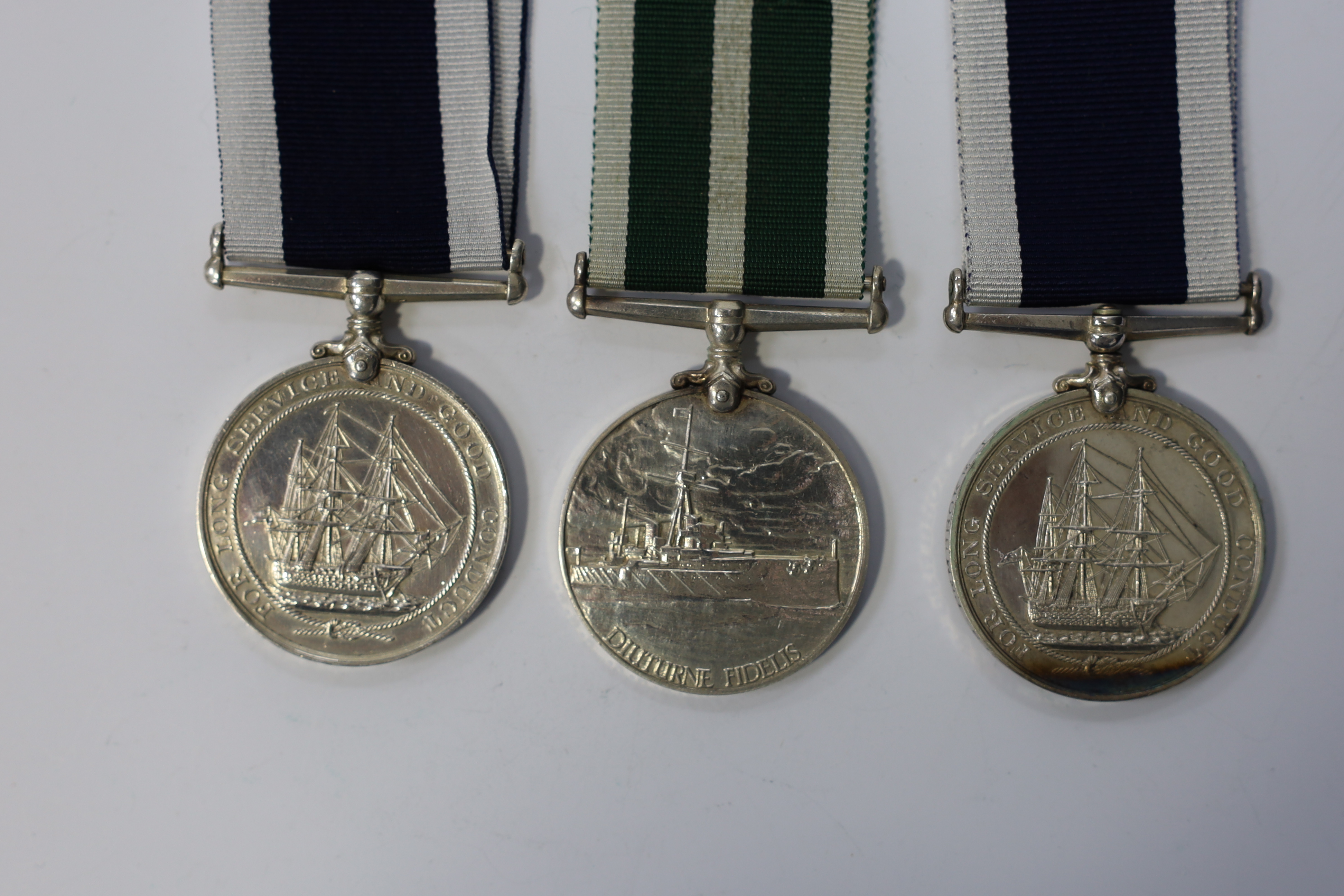 Three Naval LSGC medals; GV RNLSGC to 218949. S.H.Hasler.A.B. H.M.S.Pembroke.I.; GV RNLSGC to 351697 A.E.Day. S.B.P.O. H.M.S.Pembroke.; GVI RNRLSGC to 208. E.D. A.B.Jenkins.E.R.A. R.N.R. Condition - fair to good